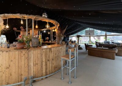 Guests are welcomed at the bar and reception of Glastonbury Retreat